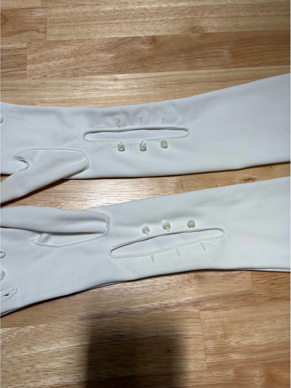 Five pairs of dress gloves. One pair of opera length gloves. Small size.